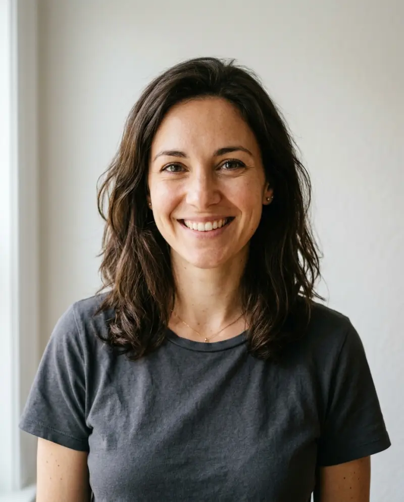 AI-made adult model, before: a smiling woman in daylight